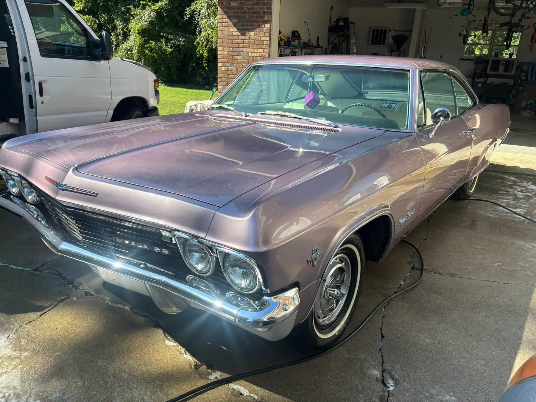 Polished classic car in a driveway